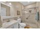 Updated bathroom features walk-in shower, stylish tile, and new vanity at 152 Abundant Ave, Angier, NC 27501