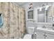 Cozy bathroom with a vanity, toilet, and shower, decorated in neutral tones and featuring tile accents at 152 Abundant Ave, Angier, NC 27501