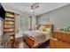 Bedroom featuring hardwood floors, ceiling fan, and plenty of natural light at 152 Abundant Ave, Angier, NC 27501