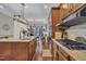 Gourmet kitchen connects to a dining area featuring hardwood floors, stainless appliances, and granite counters at 152 Abundant Ave, Angier, NC 27501