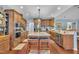 Modern kitchen with a large island, stainless steel appliances, and custom wood cabinets at 152 Abundant Ave, Angier, NC 27501
