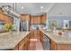 Spacious kitchen features granite countertops, stainless steel appliances, and ample cabinet space at 152 Abundant Ave, Angier, NC 27501