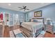 Large main bedroom offering wood floors, natural light, and a ceiling fan at 152 Abundant Ave, Angier, NC 27501