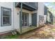 Exterior patio with sliding glass doors to the townhouse and storage area at 205 Ashley Forest Rd # Bldg D, Chapel Hill, NC 27514
