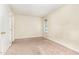 Neutral-toned bedroom with carpet, natural light, and a closet door at 205 Ashley Forest Rd # Bldg D, Chapel Hill, NC 27514