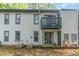 Exterior of condo with backyard, and upper level balcony at 205 Ashley Forest Rd # Bldg D, Chapel Hill, NC 27514