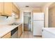 An open kitchen features light-colored cabinets and ample countertop space at 205 Ashley Forest Rd # Bldg D, Chapel Hill, NC 27514