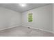 Bedroom featuring neutral walls and carpet, with a window bringing in natural light at 211 Forestview Dr, Elon, NC 27244