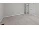 Bedroom featuring neutral walls and carpet, with natural light from two windows at 211 Forestview Dr, Elon, NC 27244