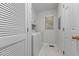 Clean laundry room with washer, dryer, cabinets, and window at 211 Forestview Dr, Elon, NC 27244