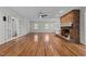 Large living room with a fireplace, built-in shelving, and an open floor plan at 211 Forestview Dr, Elon, NC 27244
