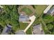 Aerial view of the property with lush landscaping at 213 Brompton Ct, Burlington, NC 27215