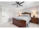 Bedroom featuring a stylish bed frame, bedside tables and a ceiling fan at 213 Brompton Ct, Burlington, NC 27215