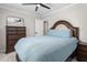 Comfortable bedroom featuring a wooden bed frame and matching dressers at 213 Brompton Ct, Burlington, NC 27215
