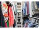 Organized walk-in closet featuring built-in shelving and hanging rods for ample storage at 213 Brompton Ct, Burlington, NC 27215