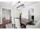 Elegant dining area with a stylish light fixture and seating for six at 213 Brompton Ct, Burlington, NC 27215