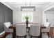 Dining area features a modern light fixture, stylish table and comfortable seating for six at 213 Brompton Ct, Burlington, NC 27215