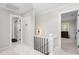Upstairs hallway with access to bedrooms and bathrooms, natural light, and neutral paint at 213 Brompton Ct, Burlington, NC 27215