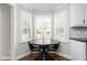 Eat-in kitchen nook with bay windows and seating at 213 Brompton Ct, Burlington, NC 27215