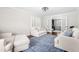 Bright living room featuring hardwood floors, comfortable seating, and a doorway leading to another room at 213 Brompton Ct, Burlington, NC 27215