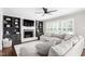 Comfortable living room with fireplace, built-in shelving, and cozy sectional sofa at 213 Brompton Ct, Burlington, NC 27215