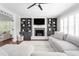 Spacious living room with fireplace, shelving, and open doorway at 213 Brompton Ct, Burlington, NC 27215