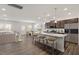 Spacious open-concept kitchen featuring a large island, stainless steel appliances, and stylish pendant lighting at 3205 Pelican Ln, Durham, NC 27703