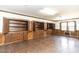 Spacious basement featuring wood flooring, built-in cabinets, and wood trim at 322 Gravley Dr, Rocky Mount, NC 27804