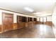 Spacious basement featuring wood flooring, built-in cabinets, and wood trim at 322 Gravley Dr, Rocky Mount, NC 27804