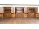 Spacious basement featuring wood flooring and built-in cabinets with rustic hardware at 322 Gravley Dr, Rocky Mount, NC 27804