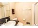 Clean bathroom with a single sink vanity, framed mirror and a shower at 322 Gravley Dr, Rocky Mount, NC 27804