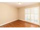 Sunlit room features hardwood floors and large windows with shutters at 322 Gravley Dr, Rocky Mount, NC 27804