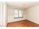 Charming bedroom with hardwood floors, built-in bookcases, window seat, and natural light at 322 Gravley Dr, Rocky Mount, NC 27804