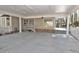 Large carport features a concrete floor, supporting columns, and a view of the yard and surrounding trees at 322 Gravley Dr, Rocky Mount, NC 27804