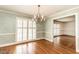 Formal dining room with plantation shutters, a chandelier, and hardwood floors at 322 Gravley Dr, Rocky Mount, NC 27804