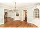 Dining room featuring hardwood floors, built-in cabinets, and access to other rooms at 322 Gravley Dr, Rocky Mount, NC 27804