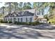 Charming home with manicured bushes, classic shutters, and a covered carport, offering a blend of comfort at 322 Gravley Dr, Rocky Mount, NC 27804