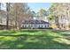Inviting home with a well-manicured lawn, mature trees, and charming exterior, creating a serene curb appeal at 322 Gravley Dr, Rocky Mount, NC 27804