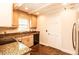 Charming kitchen with granite counters, wooden cabinets, and modern appliances at 322 Gravley Dr, Rocky Mount, NC 27804