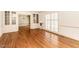 Bright living room boasting hardwood floors, built-in cabinets, and elegant shutters for a cozy atmosphere at 322 Gravley Dr, Rocky Mount, NC 27804