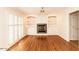 Bright living room with fireplace, built-in shelving, and hardwood floors at 322 Gravley Dr, Rocky Mount, NC 27804