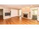 Spacious living room with hardwood floors, fireplace, built-in shelving, and access to other rooms at 322 Gravley Dr, Rocky Mount, NC 27804