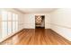 Bright and airy living room boasting hardwood floors and plantation shutters, and neutral walls at 322 Gravley Dr, Rocky Mount, NC 27804