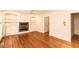 Hardwood floors, fireplace, built-in cabinets, and natural light enhance the living room at 322 Gravley Dr, Rocky Mount, NC 27804
