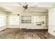 Bright sunroom features brick flooring, built-in cabinets, and many windows letting in natural light at 322 Gravley Dr, Rocky Mount, NC 27804
