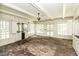 Bright sunroom features brick flooring, built-in cabinets, wet bar, and many windows letting in natural light at 322 Gravley Dr, Rocky Mount, NC 27804