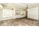 Bright sunroom features brick flooring, built-in cabinets, and many windows letting in natural light at 322 Gravley Dr, Rocky Mount, NC 27804