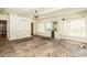 Bright sunroom features brick flooring, built-in cabinets, and many windows letting in natural light at 322 Gravley Dr, Rocky Mount, NC 27804