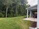 Expansive backyard with a covered patio area, ideal for outdoor gatherings and recreation at 325 Olde Liberty Dr, Youngsville, NC 27596