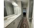 Bright bathroom showcasing a double vanity, modern lighting, quartz countertop, and glass enclosed shower at 325 Olde Liberty Dr, Youngsville, NC 27596